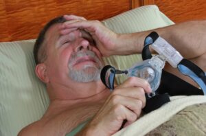 man having problems with CPAP medical device